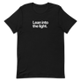 Lean Into the Light Unisex Tee