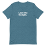 Lean Into the Light Unisex Tee